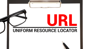 Image of the acronym 'URL' with 'Uniform Resource Locator' written underneath, accompanied by glasses and a pen.